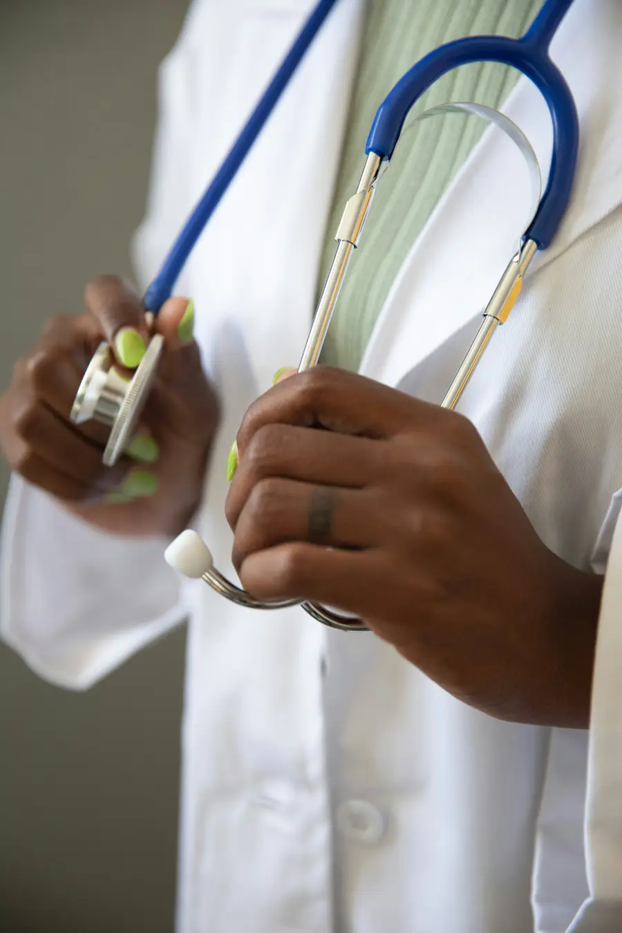 A healthcare professional holding a stethoscope